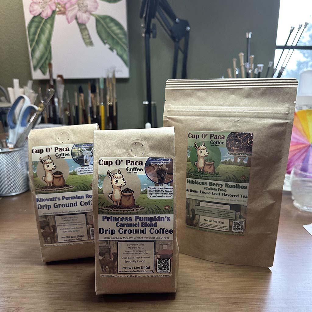 Packaging examples of both Coffee and Tea sitting on an art desk