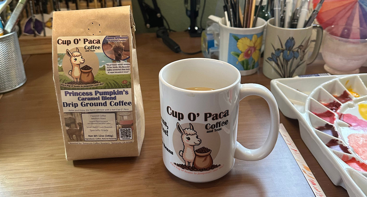 Photo of our Specialty Coffee Packaging and a Cup O' Paca mug.